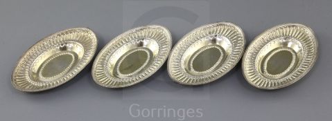 A set of four George III embossed silver gilt oval nut dishes by John Emes, London, 1799, 13cm, 8