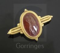 A Victorian Castellani gold and Roman carnelian intaglio archaeological revival style brooch, the