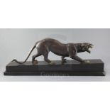 Irénée Rochard (1906-1984). An Art Deco bronze model of a prowling panther, on black marble