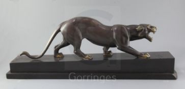 Irénée Rochard (1906-1984). An Art Deco bronze model of a prowling panther, on black marble