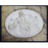 A 19th century Italian carved white marble relief plaque of The Holy Family, oval within a