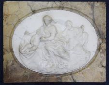 A 19th century Italian carved white marble relief plaque of The Holy Family, oval within a