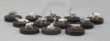 A set of twelve silver menu holders by Patrick Mavros in the form of African wild animals on