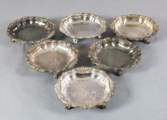 A set of six 19th century Sheffield plate vegetable dishes, no covers, with foliate borders, on four