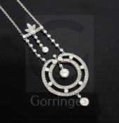 A Belle Epoque platinum? and diamond millegrain set openwork circular drop pendant necklace, with