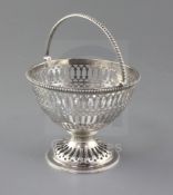 A George III pierced silver pedestal sugar basket (no liner) by Robert Hennell, with engraved