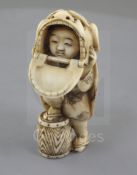 A Japanese ivory netsuke of a shishimai dancer, Meiji period, signed Nagatame, with one foot on a