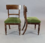 A set of 10 William IV mahogany dining chairs with tablet cresting rails, scroll spars and turned