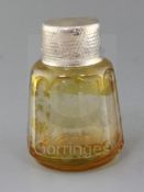 A German amber coloured spar glass perfume bottle, late 19th century, with English spot hammered