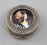 A late 19th/early 20th century French silver and Limoges enamel circular snuff box and cover, the