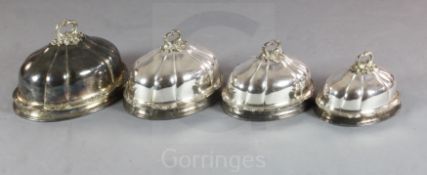 A set of four 19th century Sheffield plate graduated domed meat dish covers, of shaped oval form