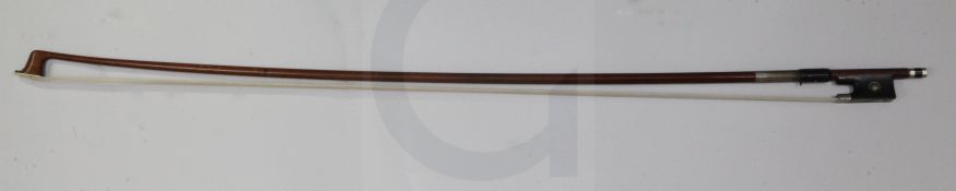 A German nickel mounted violin bow, stamped W E Dorfler, the stick rounded, with mother-of-pearl