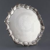 A George II silver salver by Robert Abercrombie, of shaped circular form, with engraved armorial and