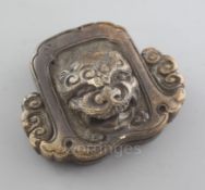 A Japanese stag antler netsuke of a roof tile with head of shishi, mid 19th century, seal mark, w.