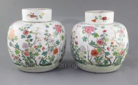 A pair of Chinese famille rose globular jars and covers, late 19th century, each finely painted with