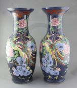 A pair of large Chinese blue ground 'dragon and phoenix' vases, 19th century, painted with dragons