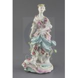 A Derby group of a Shepherdess and a sheep, c. 1760, the wasp-waisted figure standing before a