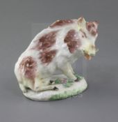 A rare Derby 'Dry-edge' figure of a wild boar, c.1752-5, seated on a flower encrusted oval mound