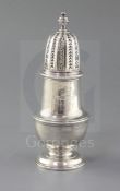 A George I silver sugar caster by Thomas Bamford, of baluster vase form, with engraved armorial,