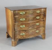 A George III serpentine mahogany dressing chest, with fitted top drawer including a fold out