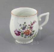 A Derby ovoid coffee cup, c.1758, with wishbone handle, painted in 'Cotton-stem painter' style