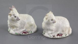 Two early Bow figures of young goats lying recumbent, c.1752-5, each base painted with mauve flowers