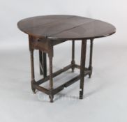 A late 17th century oak gateleg table, with oval top and frieze drawer, W.2ft 9in. H.2ft 4in.