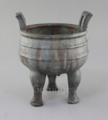 A Chinese Yixing pottery tripod censer, Ding, 18th century, decorated with a Jun type glaze, moulded