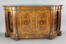 A Victorian ormolu mounted marquetry and walnut side cabinet, with two central panelled doors inlaid