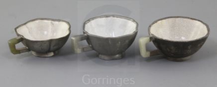 Three Chinese Yixing pewter and jade mounted cups, Daoguang period (1821-50), each of different