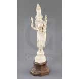 An Indian carved ivory figure of Parvati and Ganesh, c.1900, standing in abhanga on a double lotus