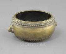 A Chinese bronze gui censer, Xuande seal mark but 18th century, with studded borders and animal mask