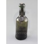 A rare Bristol black glass half wine bottle, sealed '1791', height 18.5cm
