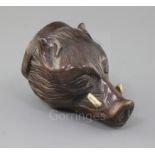 A late 18th century carved treen stirrup cup, modelled as a boar's head with inset tusks, 4.5in.