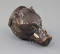 A late 18th century carved treen stirrup cup, modelled as a boar's head with inset tusks, 4.5in.