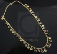 An early-mid 20th century gold and multi-coloured tourmaline drop fringe necklace, set with thirty