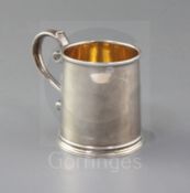 A William III silver mug by Pierre Platel, of plain cylindrical form, with scroll handle and moulded