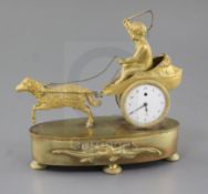 A 19th century Empire style ormolu desk timepiece, modelled as a putto in a chariot pulled by a