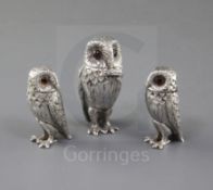 A 1960's silver three piece condiment set modelled as owls, by William Comyns & Sons Ltd, comprising