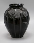 An Art Deco black glass with floral design vase 33cm high