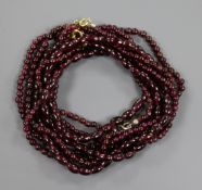 Three assorted garnet bead necklaces.