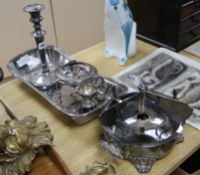 A large rectangular plated bread dish, a single plated Victorian candlestick and two plated spirit