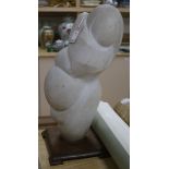 An abstract figural white marble carving, mother with child 58cm high