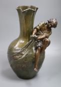 A signed Auguste Moreau bronze patinated pewter figural vase of a fisher boy 39cm high