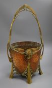 A copper and brass basket, designed planted in the Benson style 56cm high