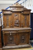 A late 19th century Renaissance style carved oak bookcase / cupboard W.140cm
