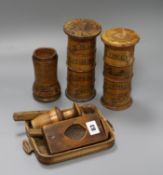 A group of Victorian treen kitchenalia including two spice towers, a pestle grinder and a pine