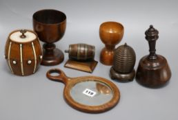 A group of assorted treen including an early Victorian rosewood toilet mirror, a beehive string