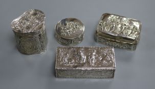 Four embossed silver trinket boxes, various, including a rectangular box decorated with musicians,