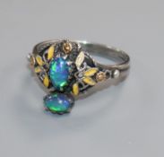 An early 20th century Arts & Crafts white metal, black opal and enamel dress ring, size N/O.